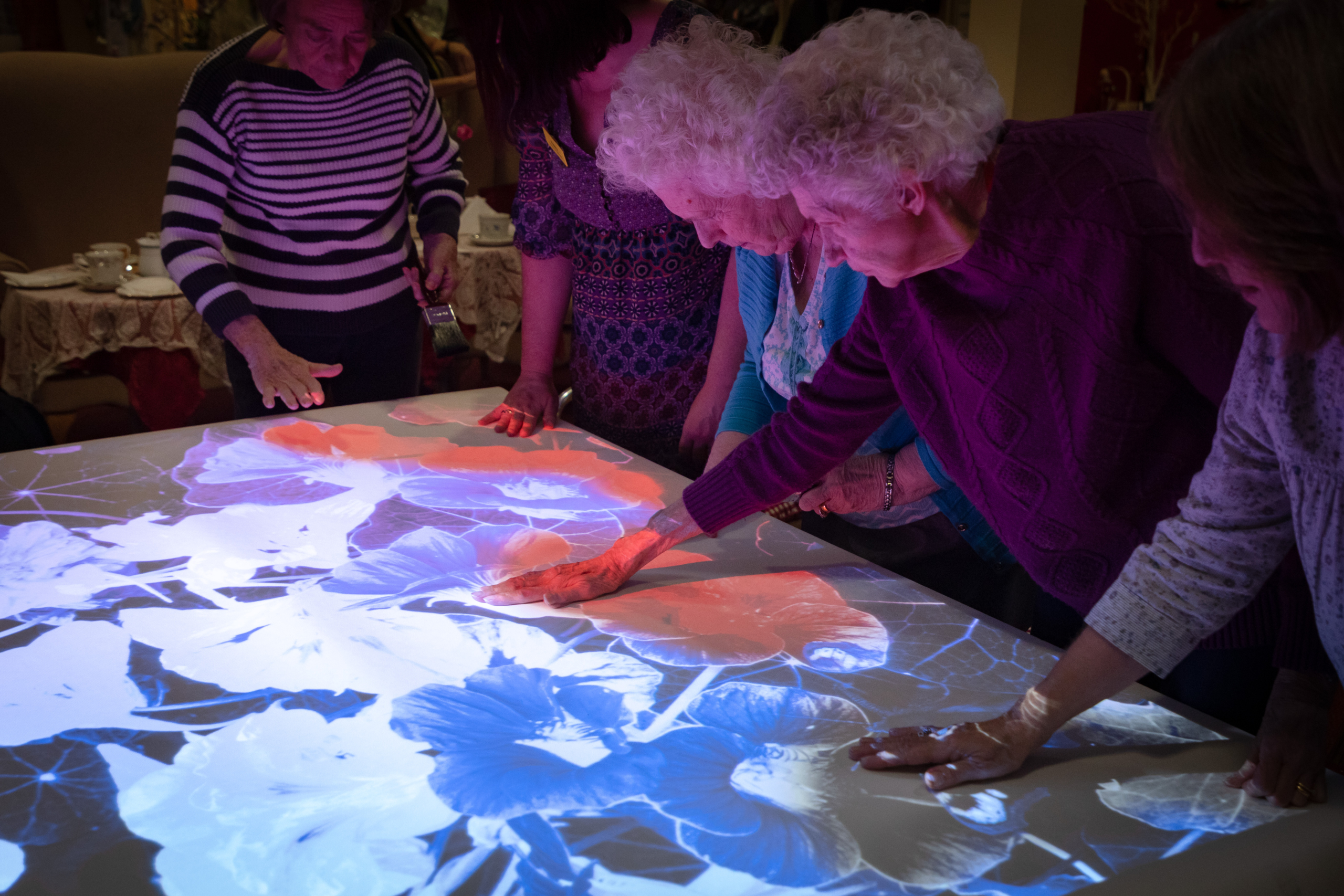 carey lodge residents enjoying sensory table top painting activities