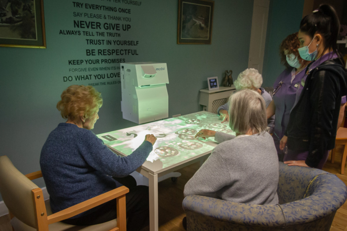 Warren Lodge Care Home residents using the Mobii Magic Table activities for Dementia