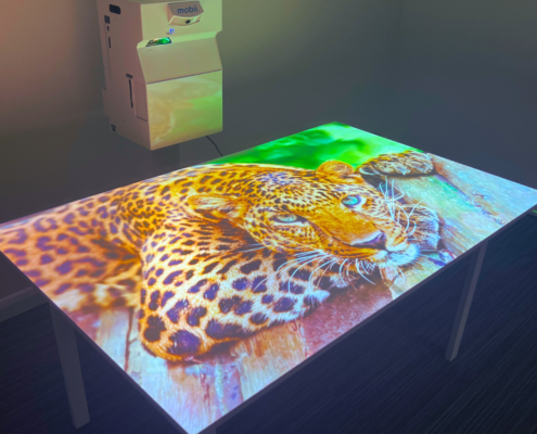 Mobii interactive sensory table projector projecting an image onto a tabletop